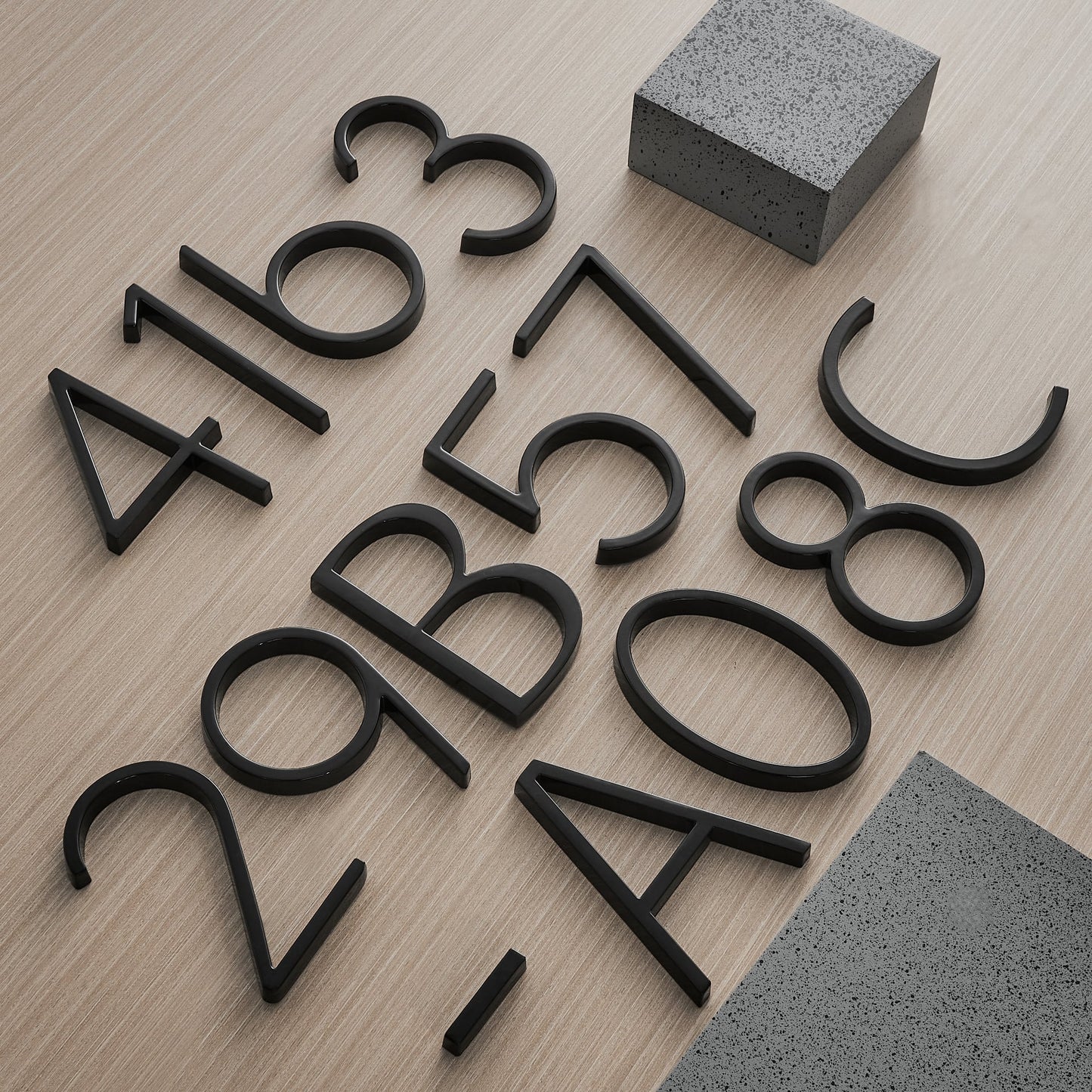 Modern House Numbers - Black house numbers with 3D floating effect for stylish outdoor areas