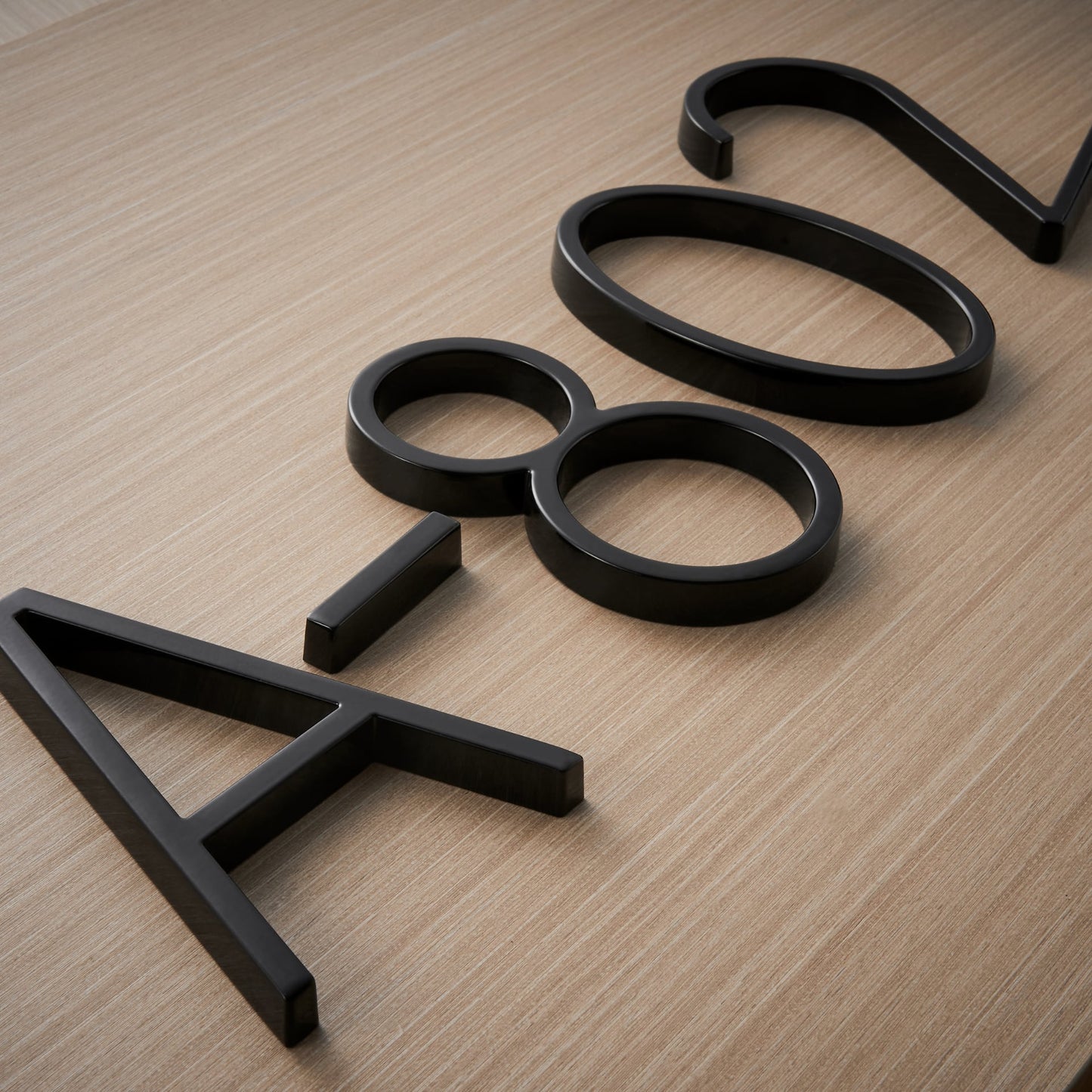Modern House Numbers - Black house numbers with 3D floating effect for stylish outdoor areas