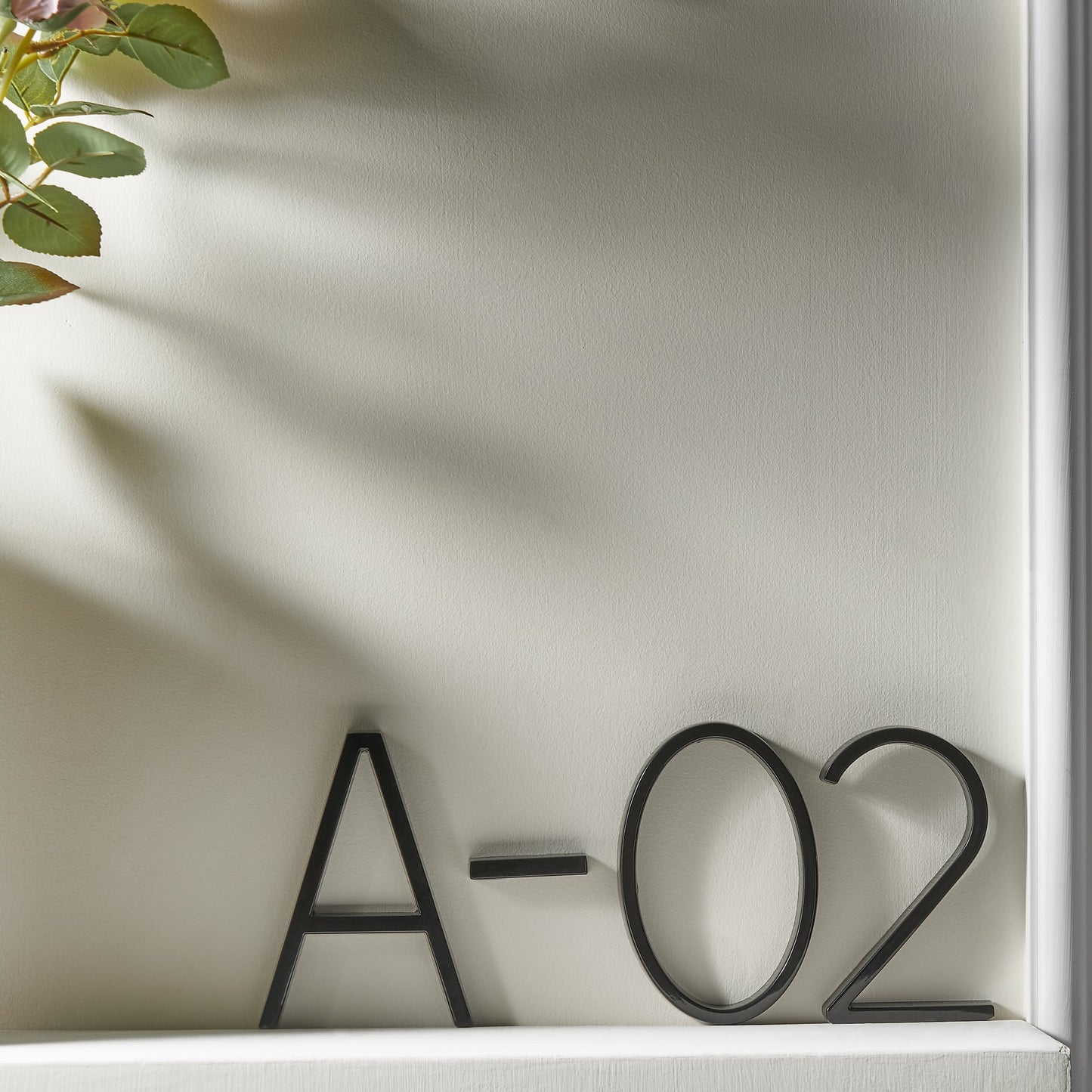 Modern House Numbers - Black house numbers with 3D floating effect for stylish outdoor areas